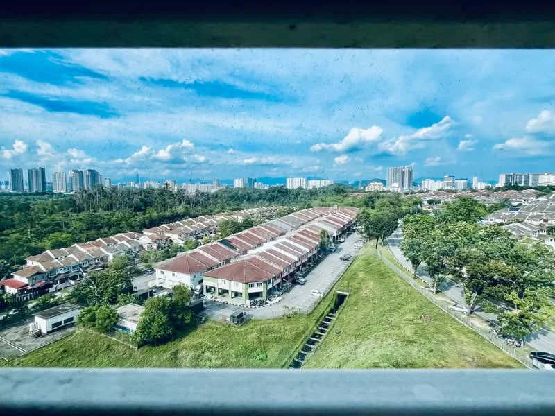 Exterior type: linked terrace house; features: red tiled roof, two-storey linked terrace houses, manicured lawn, surrounded by greenery, urban skyline in background, paved walkway, open parking spaces; style: modern.