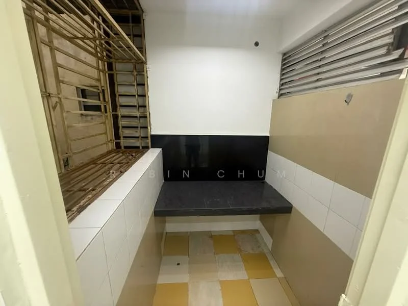 Laundry features: black countertop, white tiled walls, cream tiled walls, yellow and grey patterned flooring, metal window grilles, exposed brick wall, shelving unit, wall-mounted storage.