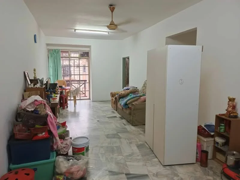 Living features: white painted walls, marble flooring, 5-blade ceiling fan, large window with green curtains, sofa with assorted cushions, wooden side table, storage cabinet, various storage boxes, decorative items on shelves.