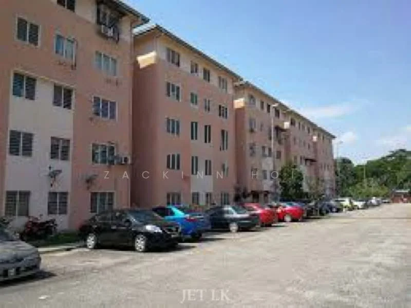 Exterior type: low-rise apartment block; features: pink painted facade, multiple storeys, windows with grilles, parking lot with multiple vehicles, landscaped area, surrounded by greenery; style: modern.