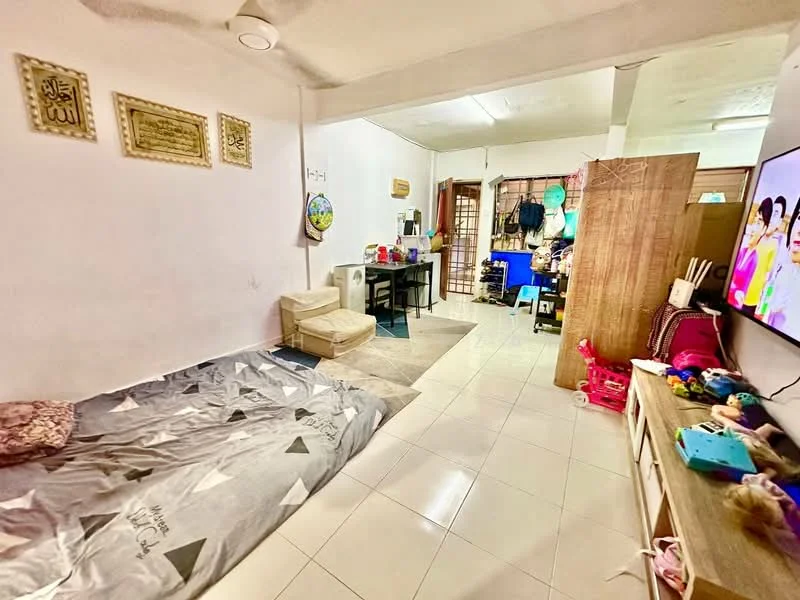 Living features: white painted walls, tile flooring, ceiling fan, wall-mounted TV, wooden TV console, sofa bed, decorative wall art, dining table with chairs, open shelving unit, various toys and decor items.