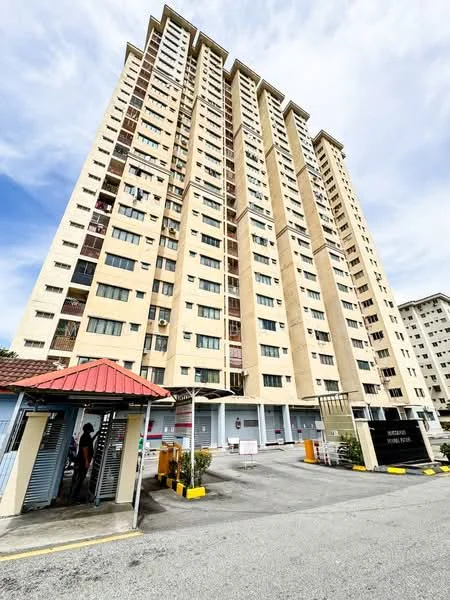 Exterior type: high-rise condominium; features: cream painted facade, glass windows, recessed balconies, multiple storeys, entrance gate with guard house, covered parking area, surrounded by mature greenery; style: modern.