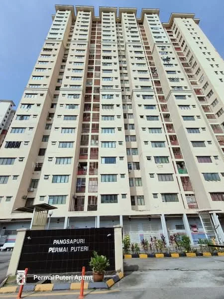 Exterior type: high-rise condominium; features: cream painted facade, glass windows, multiple balconies, entrance sign with name, ground-level parking area, landscaped garden at base, surrounded by urban environment; style: modern.