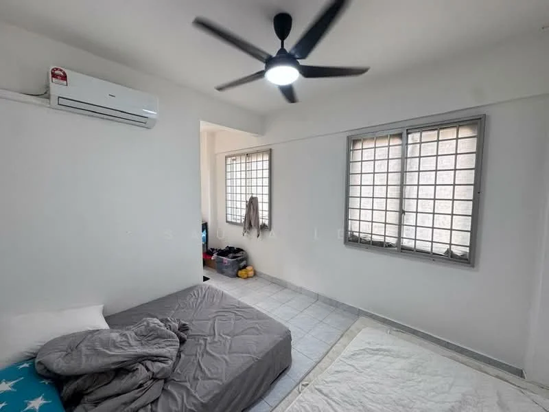 Bedroom features: white painted walls, tile flooring, 1 wall-mounted split AC, 5-blade ceiling fan with light, two windows with grid pattern, queen-size bed, bedding with grey duvet, light grey mattress, storage boxes on the floor; style: minimalist.
