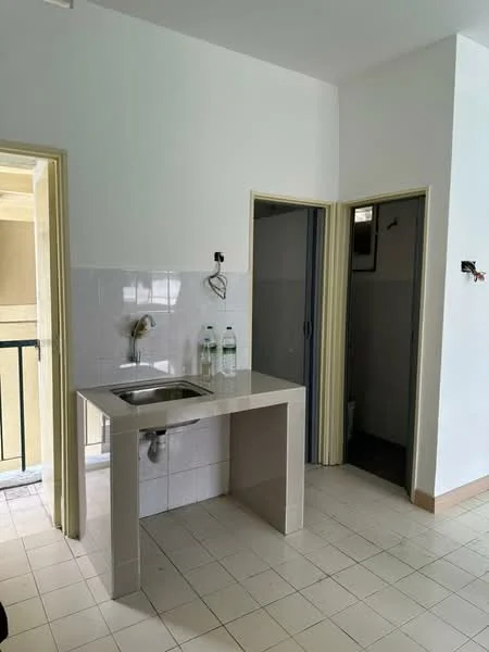 Kitchen features: single-bowl stainless-steel sink, chrome faucet, white tiled backsplash, light grey countertop, white painted walls, white ceramic tile flooring, open layout, doorway to adjacent room, doorway leading to balcony, two bottles of water on countertop.
