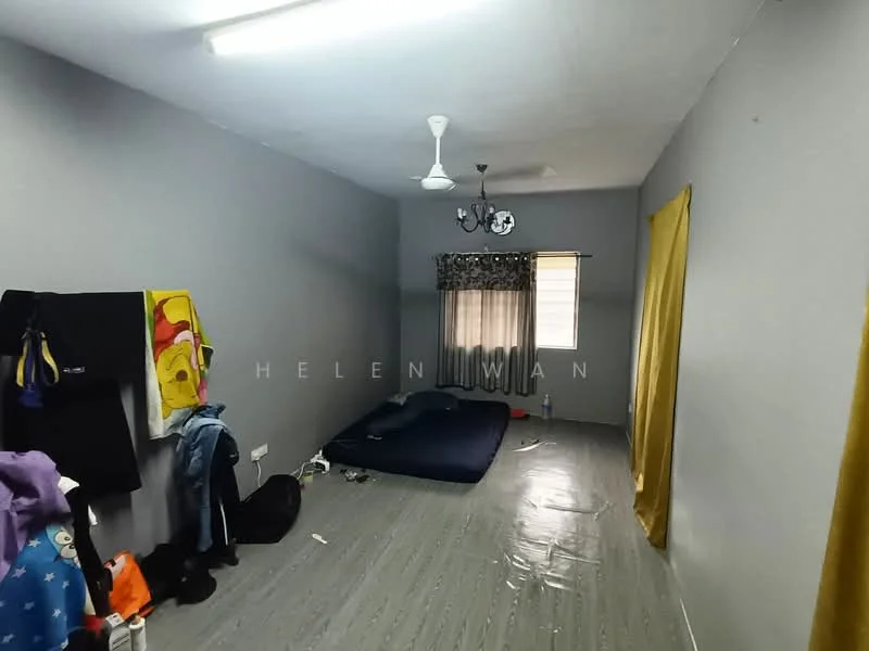Bedroom features: grey painted walls, vinyl plank flooring, ceiling fan, window with curtains, bed on the floor, decorative chandelier, clothes hanging on wall, clothes on the floor.