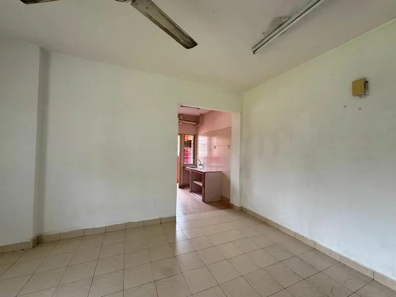 Room features: white painted walls, tile flooring, ceiling fan, window with no treatments, open layout, kitchen area visible in the background.