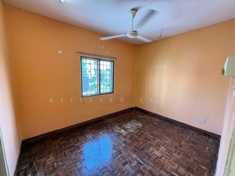 Room features: orange painted walls, parquet wood flooring, ceiling fan, single window with grid, no visible furniture, light source from ceiling, corner air conditioning unit.