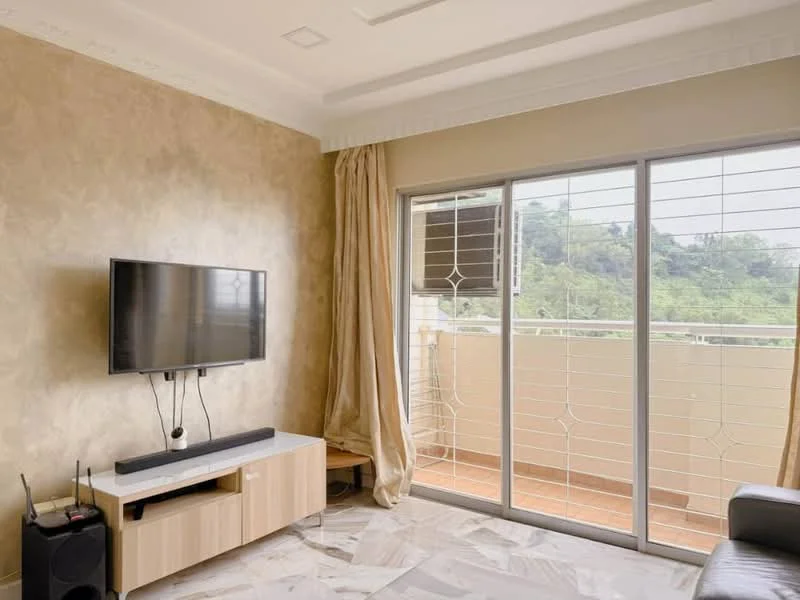 Living features: wall-mounted TV, light wood TV console, cream painted walls, marble tile flooring, floor-to-ceiling sliding glass door, sheer curtains, balcony view, sofa, decorative ceiling, recessed lighting; style: modern; view: mountain.