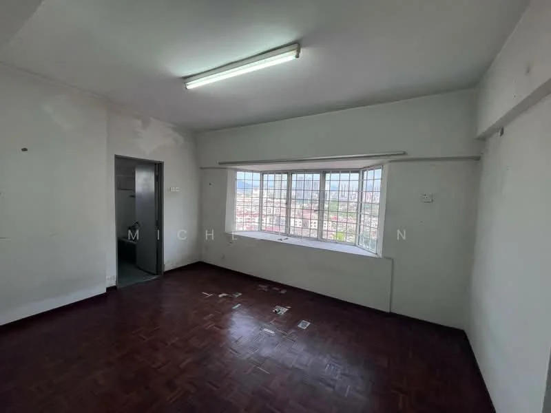 Room features: white painted walls, parquet wood flooring, large window with multiple panes, fluorescent ceiling light, door leading to another room, view of city skyline visible through window; view: city.