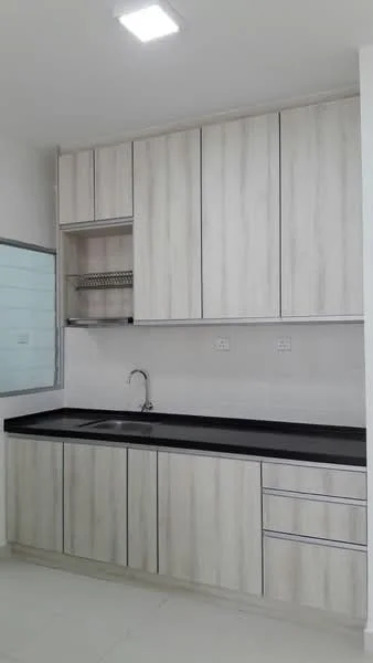 Kitchen features: light wood cabinetry, black countertop, single-bowl stainless-steel sink, chrome pull-down faucet, open shelving above sink, built-in cabinets, tile backsplash, white walls, recessed ceiling lights, ceramic tile flooring; style: modern.