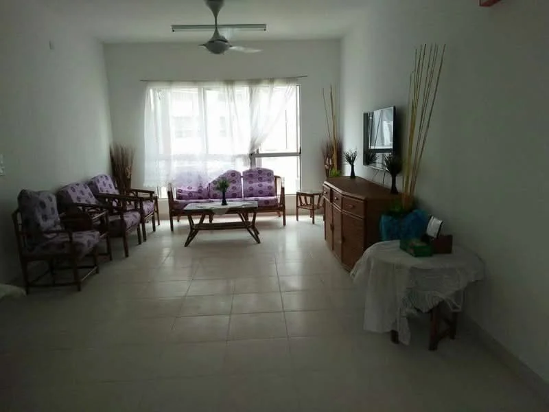 Living features: white painted walls, tile flooring, 5-blade ceiling fan, large windows with sheer curtains, purple upholstered armchairs, wooden coffee table, wooden sideboard, decorative plants in vases, area rug, TV mounted on wall; style: minimalist.