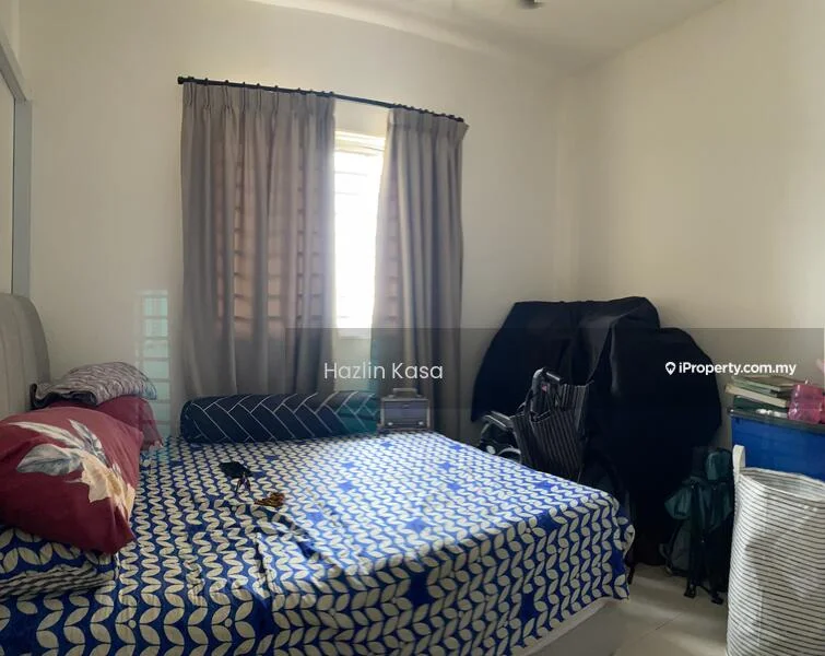 Bedroom features: queen-size bed with patterned bedding, light grey upholstered headboard, two bedside tables, window with sheer curtains, cream painted walls, tile flooring, ceiling fan, folding chair, blue storage box, black garment rack.