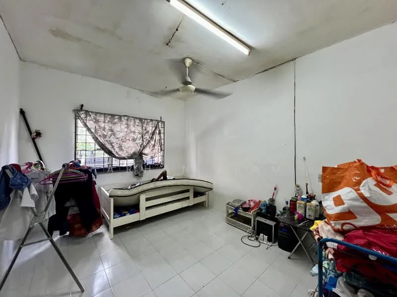 Room features: white painted walls, ceiling fan, window with sheer curtains, tile flooring, single bed frame, clothes rack, storage unit, various personal items; style: minimalist.