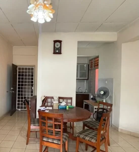 Dining features: round wooden dining table, 4 wooden dining chairs with plaid upholstery, ceiling light fixture with multiple bulbs, wall clock, tiled flooring, white painted walls, wall-mounted fan, open kitchen area visible in background; style: modern.
