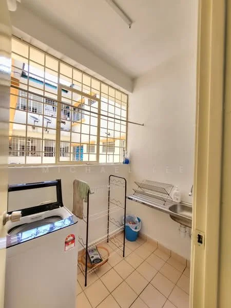 Laundry features: washing machine, metal drying rack, sink with faucet, tile flooring, white painted walls, large window with metal grille, shelf above sink, blue plastic bucket.