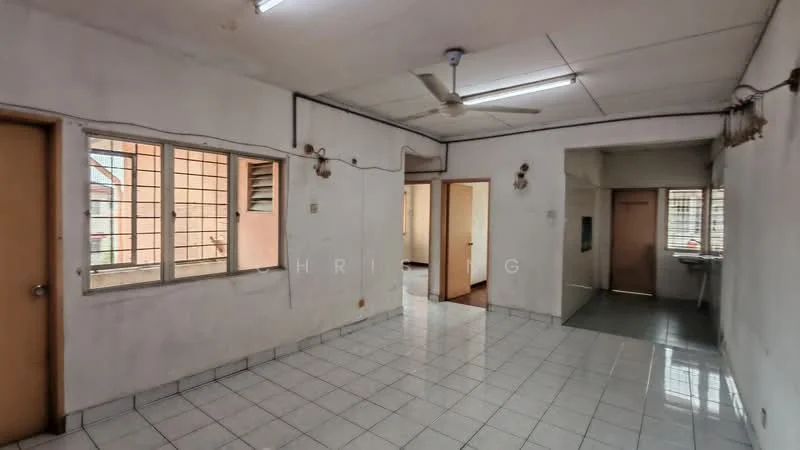 Room features: white painted walls, white tiled flooring, ceiling fan, fluorescent lighting, multiple windows, doorway leading to another room, doorway leading to kitchen area, exposed electrical wiring, plain ceiling; style: minimalist.
