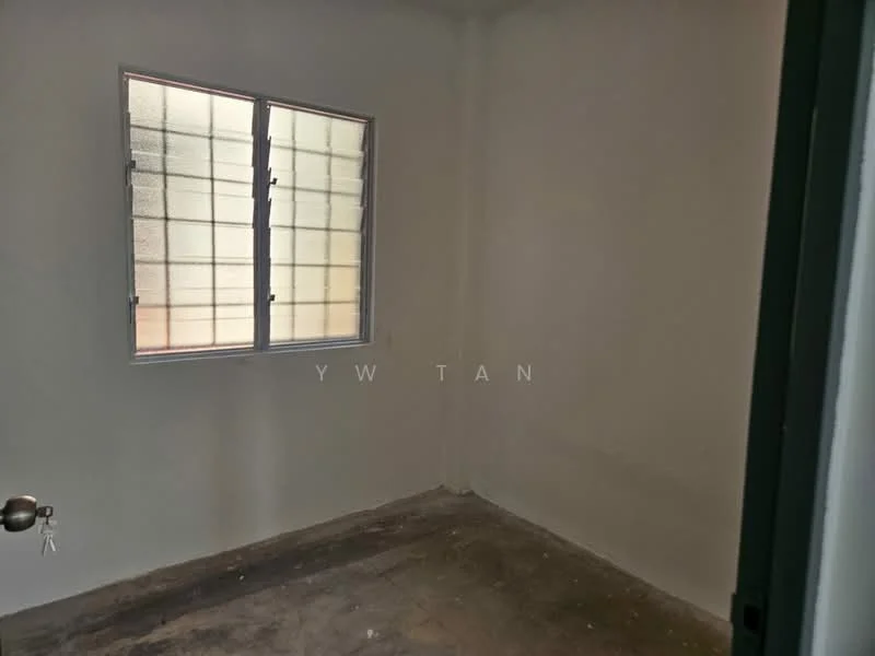 Room features: white painted walls, concrete flooring, single window with grid pattern, no visible furniture or decor.