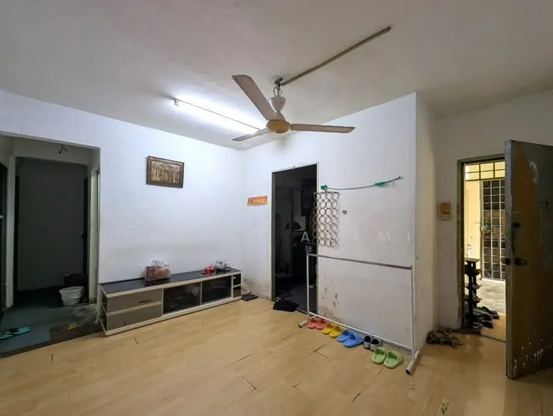 Living features: white painted walls, laminate flooring, 5-blade ceiling fan, wall-mounted TV console, doorway to adjacent rooms, sliding door to another room, decorative wall art, floor space with slippers.