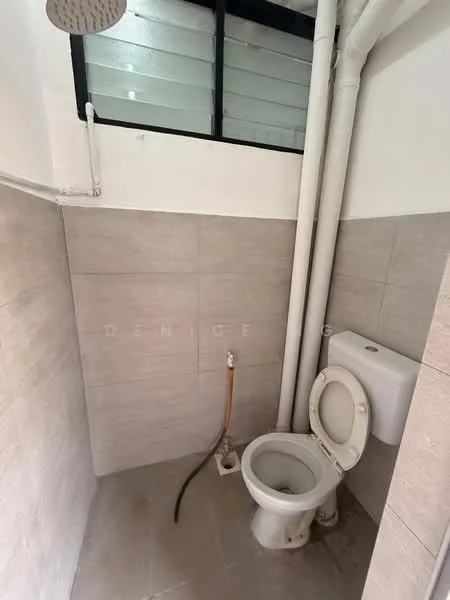 Bathroom features: one-piece toilet, wall-mounted toilet tank, shower head, tile flooring, light grey wall tiles, white wall tiles, exposed plumbing, window for natural light.