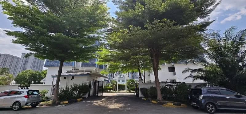 Exterior type: gated community; features: white painted facade, manicured lawn, mature trees, paved driveway, security gate, surrounded by greenery, adjacent to high-rise buildings; style: modern.