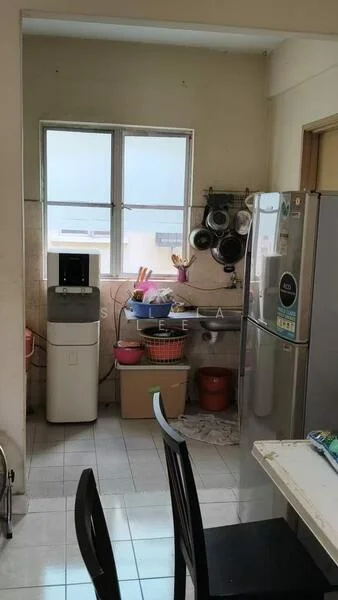 Kitchen features: white walls, tile flooring, double-bowl stainless-steel sink, chrome pull-down faucet, refrigerator, water dispenser, kitchen cabinets, countertop, window with city view, hanging pots and pans, plastic storage bins; view: city.