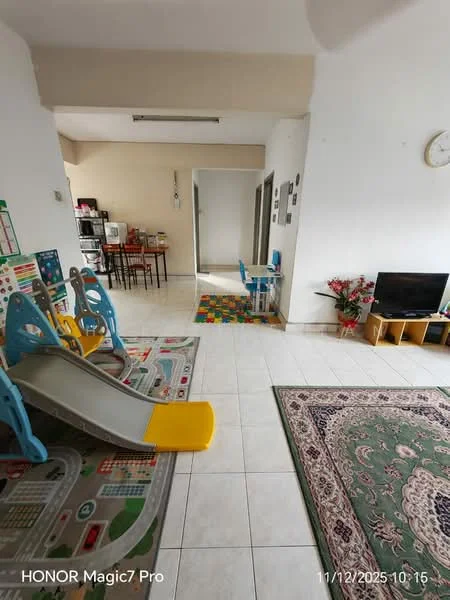 Living features: white painted walls, tile flooring, area rug with geometric pattern, sofa, TV console, wall-mounted TV, decorative plants, children's slide, play mat with road pattern, coffee table, dining table with chairs visible in background; style: modern.