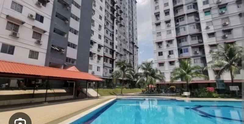 Exterior type: high-rise condominium; features: swimming pool, pool deck with loungers, landscaped garden, palm trees, manicured lawn, covered pavilion, multiple-storey building, balconies on upper floors, air conditioning units visible on facade; style: modern.