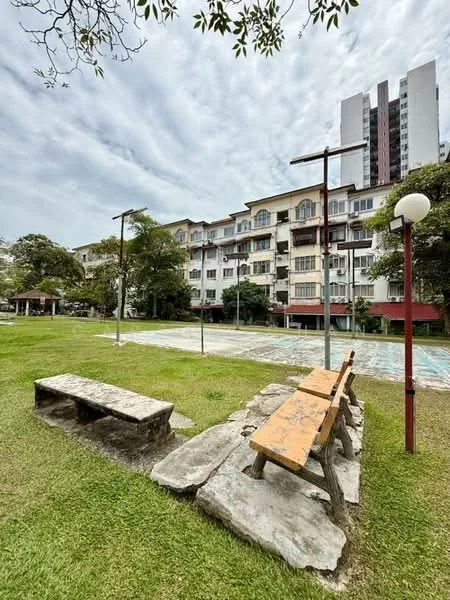 Exterior type: low-rise apartment block; features: green lawn, stone bench, wooden bench, landscaped garden, surrounding trees, multi-storey building, balconies on upper floors, outdoor lighting, paved walkway; style: modern.