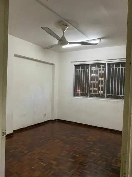 Room features: white painted walls, wooden flooring, 5-blade ceiling fan, window with metal grilles, light fixture on ceiling.