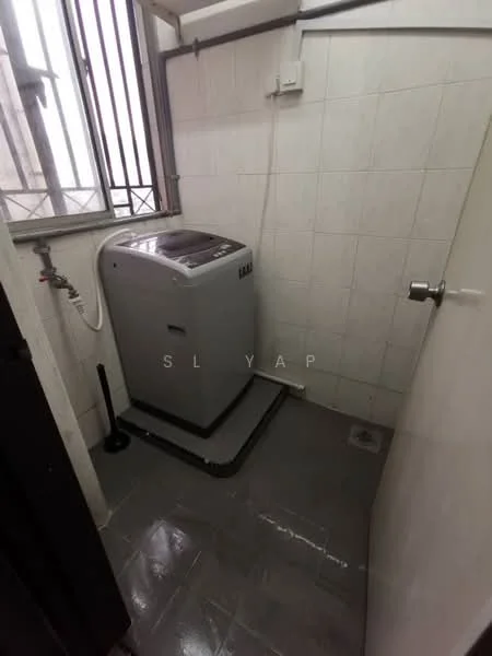 Laundry features: top-load washing machine, grey tiled flooring, white tiled walls, window with metal grille, drainage floor, plumbing connection, light fixture on ceiling, door leading to hallway.