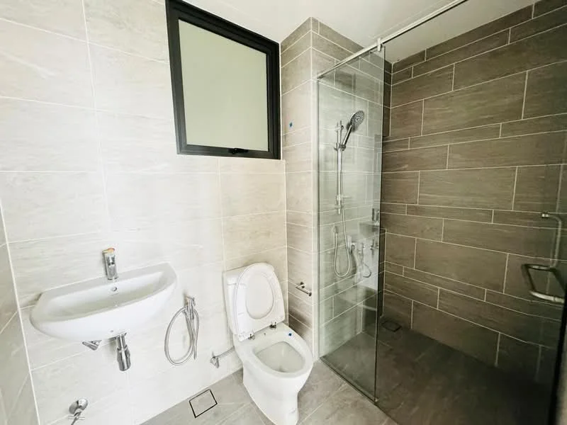 Bathroom features: grey tile flooring, light grey wall tiles, white wall-mounted sink, chrome faucet, one-piece toilet, glass shower enclosure, rain shower head, handheld shower, window with black frame; style: modern.