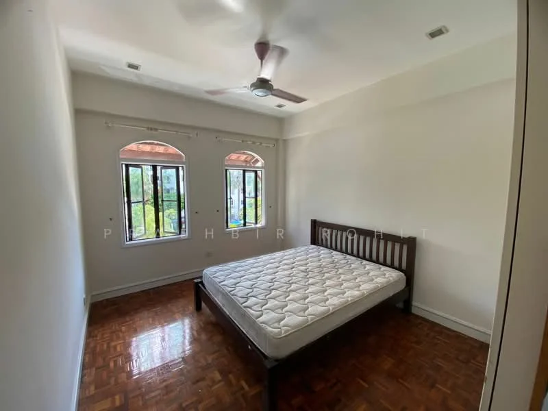 Bedroom features: wooden flooring, white painted walls, 5-blade ceiling fan, two arched windows, unframed mattress on bed frame, natural light from windows, decorative window grills; view: garden.