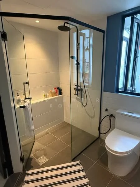 Bathroom features: walk-in shower with glass enclosure, rain shower head, handheld shower, white tiled walls, grey floor tiles, toilet, chrome basin mixer, window with black frame, towel rack, shower niche with toiletries; style: modern.