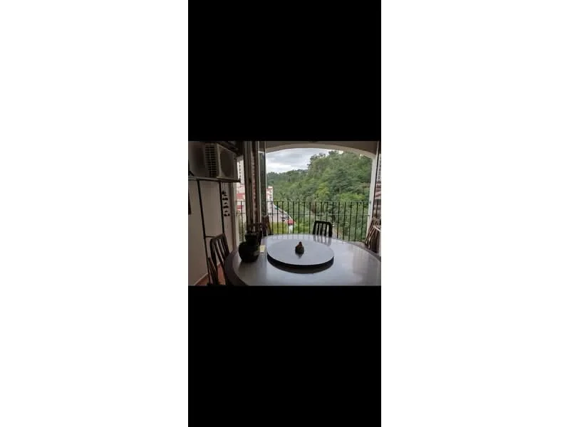 Balcony features: round dining table, 4 dining chairs, view of greenery, floor-to-ceiling sliding glass door, railings, outdoor flooring, air conditioning unit; view: garden.
