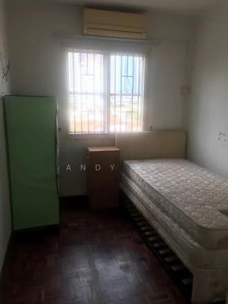 Bedroom features: single bed frame, mattress without bedding, green fridge, wooden bedside table, window with blinds, wall-mounted air conditioning unit, parquet wood flooring, white painted walls.