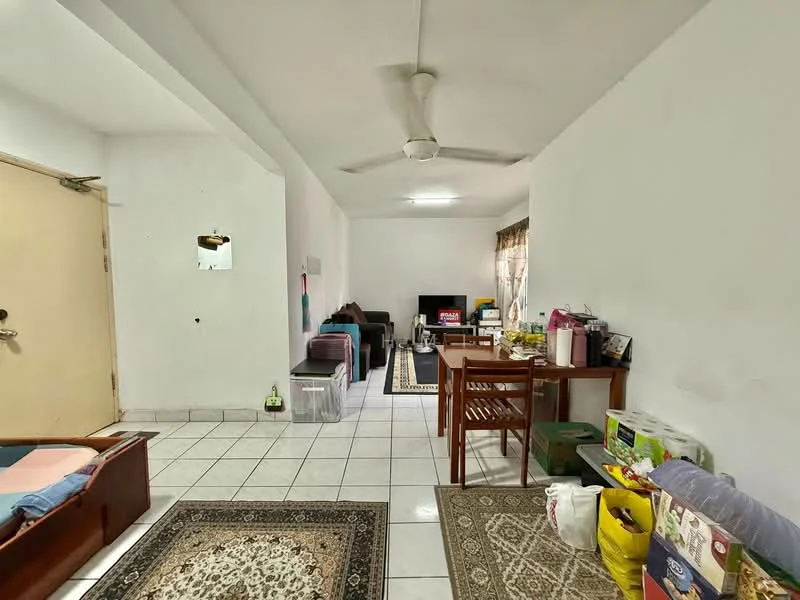 Living features: white painted walls, tiled flooring, 5-blade ceiling fan, sofa in purple, sofa in green, wooden dining table, 4 dining chairs, area rug with geometric pattern, TV console, wall-mounted TV, decorative items on shelves, window with sheer curtains.