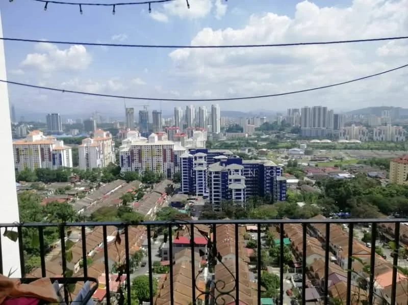 Exterior type: high-rise condominium; features: city skyline view, balcony railing, surrounding greenery, urban landscape, multiple high-rise buildings, residential houses below, clear blue sky, decorative string lights; style: modern.