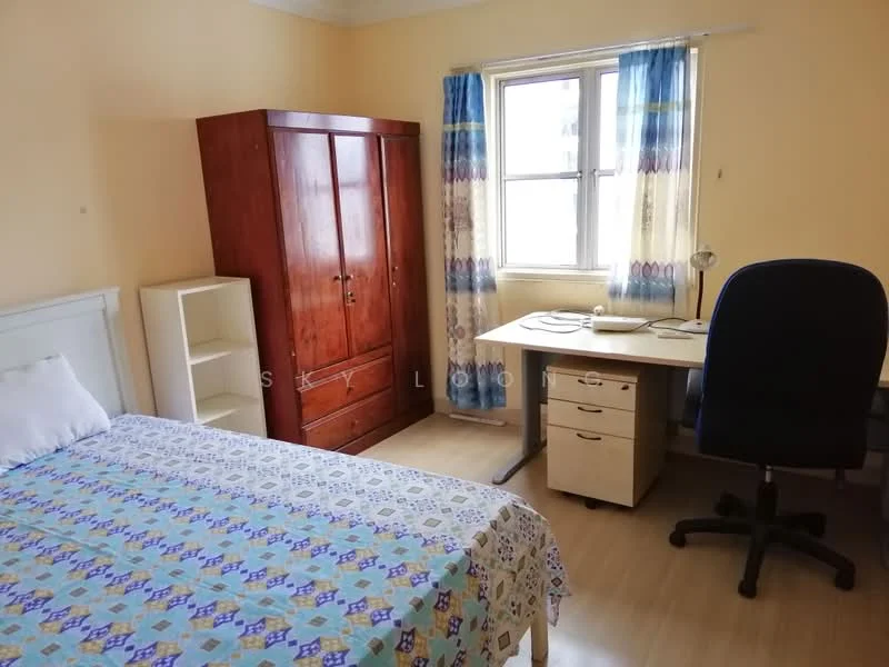Bedroom features: queen-size bed with patterned bedspread, wooden wardrobe, study desk with chair, white bookshelf, curtains with blue and yellow pattern, window with natural light, laminate flooring, light yellow painted walls.