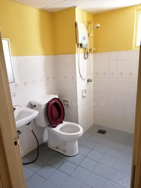 Bathroom features: yellow painted walls, white tiled walls, white ceramic floor tiles, toilet, sink with chrome faucet, shower with wall-mounted showerhead, water heater, small window, drain in floor.