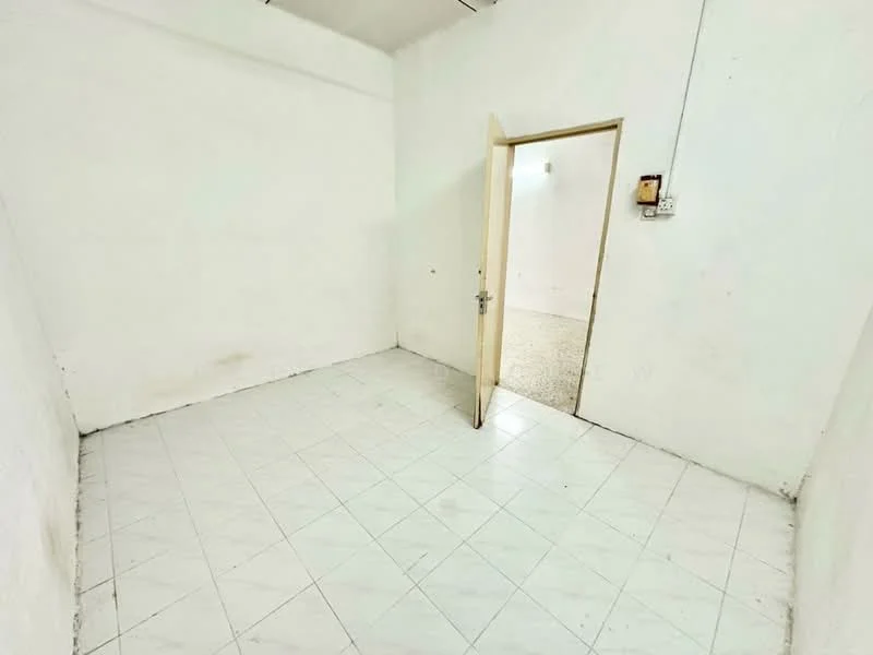 Room features: white painted walls, white tiled flooring, single door, light source from ceiling, empty space; style: minimalist.