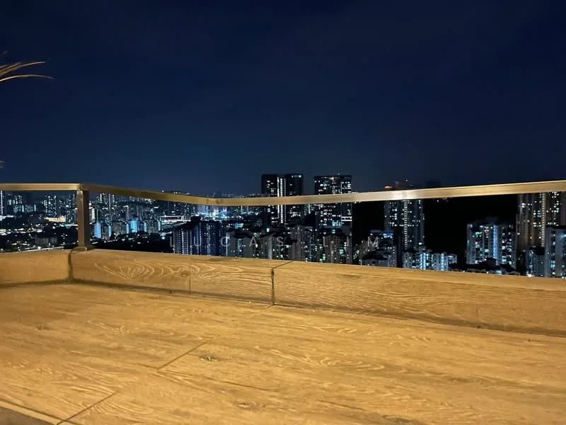 Exterior type: high-rise condominium; features: city skyline view, glass railing, wooden decking, night lighting, surrounding high-rise buildings; style: modern.