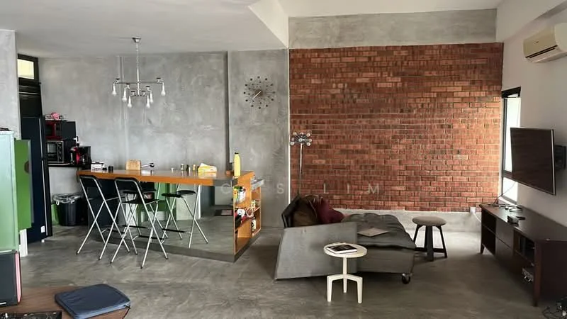 Living features: exposed brick accent wall, grey concrete walls, polished concrete flooring, 5-blade ceiling fan, wall-mounted TV, entertainment unit, sofa in grey fabric, coffee table, floor lamp, dining table with stools, clock on wall, large windows with natural light; style: industrial. Kitchen features: stainless-steel fridge, built-in oven, freestanding range oven, black cabinetry, kitchen island with seating, sink, countertop with bar stools; style: industrial.