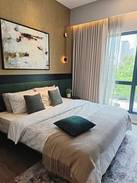 Bedroom features: queen-size bed with white bedding, upholstered headboard, decorative throw pillows, wooden accent wall, framed artwork on wall, floor-to-ceiling windows, sheer curtains, greenery view outside, area rug with geometric pattern, nightstand with lamp, wall-mounted sconce lighting; style: modern; view: garden.