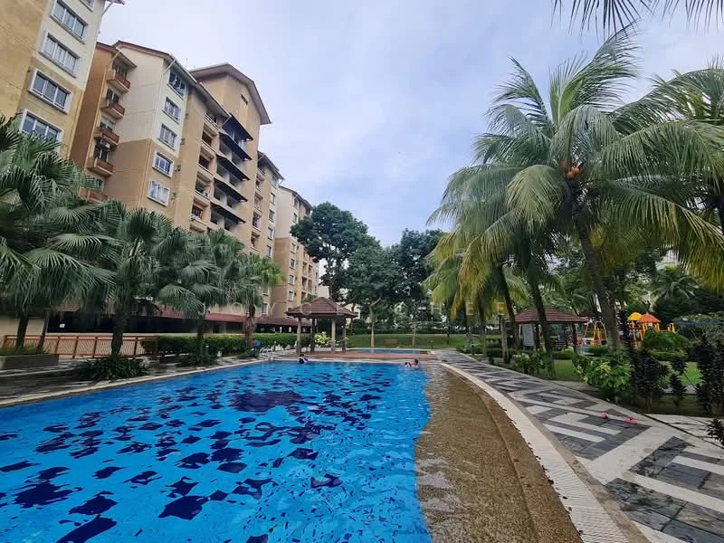 Exterior type: mid-rise condominium; features: swimming pool, pool deck with loungers, landscaped garden with palm trees, children's playground, manicured lawn, paved walkway, gazebo, multiple storeys, balconies on upper floors, lush greenery surrounding the area; style: modern.