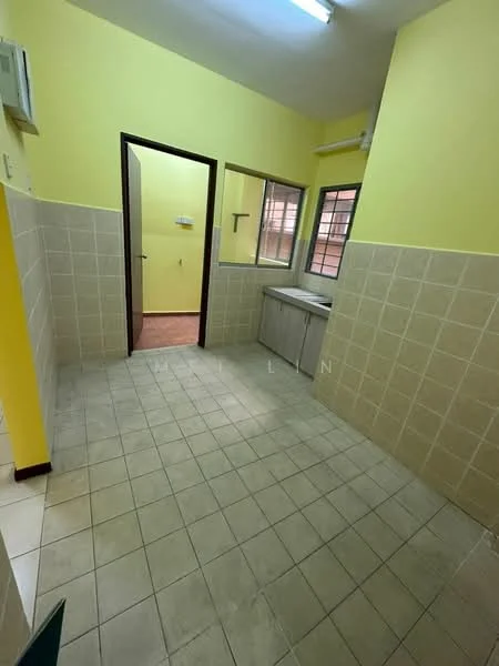 Laundry features: yellow painted walls, cream tiled walls, light grey tiled flooring, single-bowl stainless-steel sink, countertop with storage below, window with metal grille, door leading to another room, fluorescent ceiling light.
