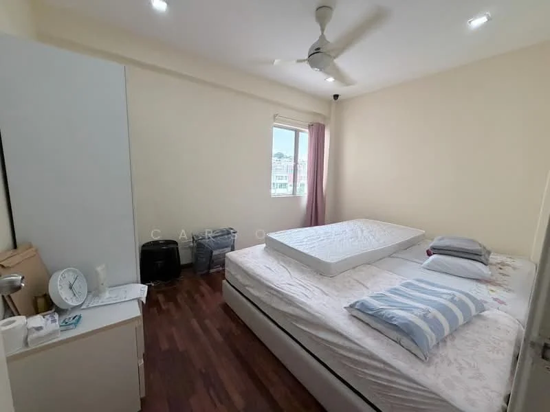 Bedroom features: queen-size bed, wooden flooring, white painted walls, ceiling fan, window with city view, two pillows, mattress on bed frame, nightstand, clock, plastic storage bins; view: city.