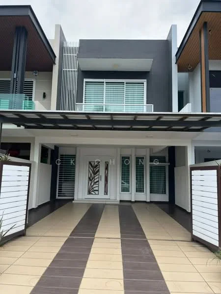 Exterior type: linked terrace house; features: modern facade with grey and white elements, glass balcony railing, sliding glass doors, decorative front door with panel design, horizontal wooden slats on walls, paved walkway with alternating colors, overhang roof, landscaped entrance area; style: modern.