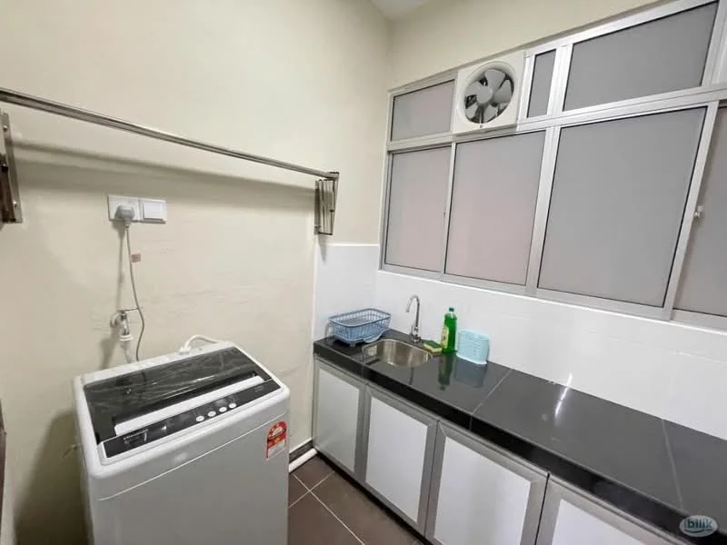 Laundry features: top-load washing machine, single-bowl stainless-steel sink, black countertop, white cabinetry, grey tiled flooring, window with metal frame, wall-mounted drying rack, wall-mounted fan.