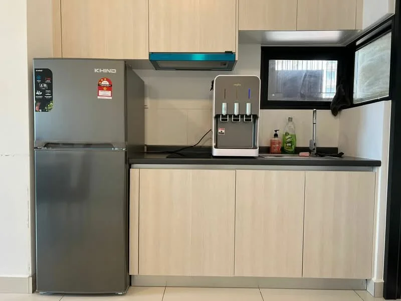 Kitchen features: stainless-steel fridge, built-in kitchen cabinetry with light wood finish, black countertop, water dispenser, single-bowl stainless-steel sink, chrome pull-down faucet, wall-mounted range hood, tile flooring, window with black frame; style: modern.